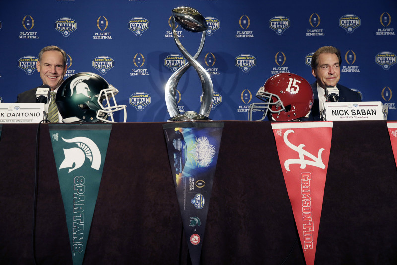 Michigan State head coach Mark Dantonio left and Alabama head coach Nick Saban smile during a news conference for the Cotton Bowl in Arlington Texas