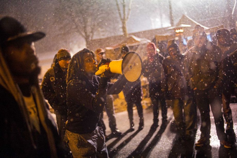 At the 4th Precinct in North Minneapolis Black Lives Matter protesters anticipated a possible raid on their encampment that evening. Four men were charged Monday Nov. 30 2015 in last week's shooting of demonstrators protesting the killing of a black