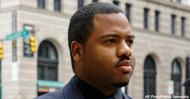 Officer William Porter one of six Baltimore city police officers charged in connection to the death of Freddie Gray walks into a courthouse during jury deliberations Wednesday Dec. 16 2015 in Baltimore