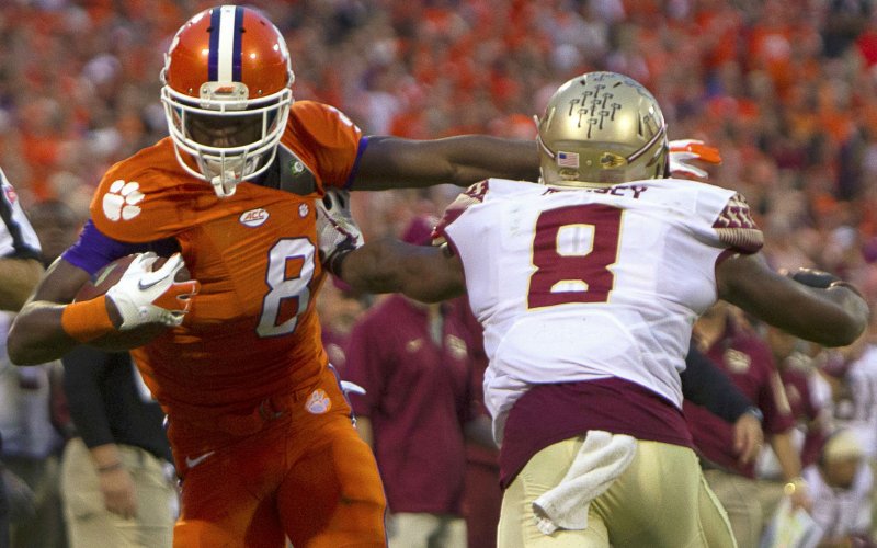 Nov 7 2015 Clemson SC USA Clemson Tigers wide receiver Deon Cain carries the ball while being defined by Florida State Seminoles defensive back Jalen Ramsey during the first half at Clemson Memorial Stadium