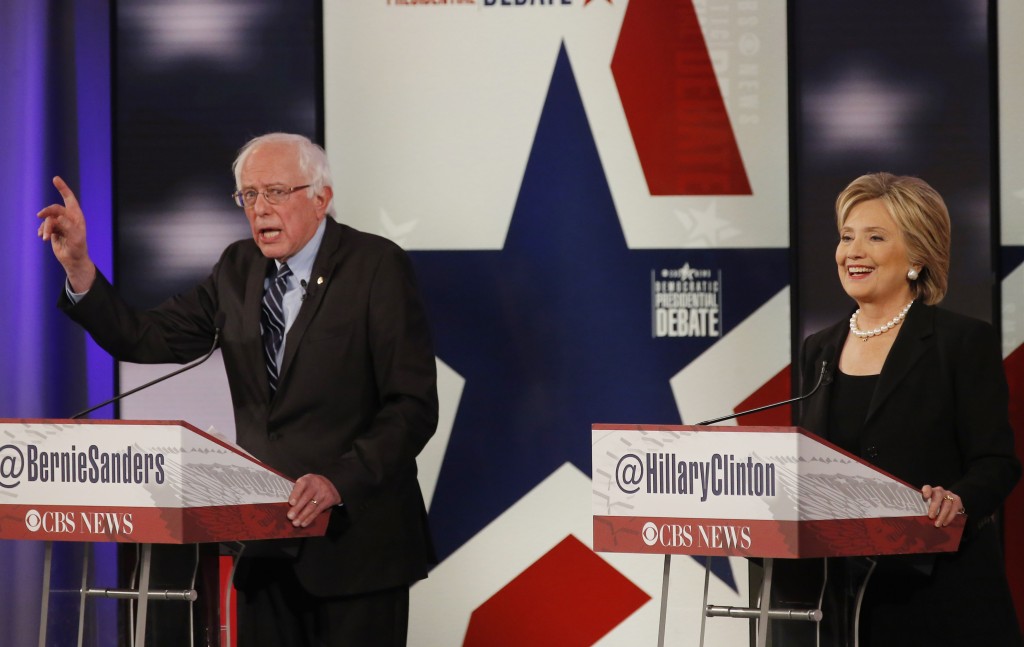 Democratic U.S. presidential candidates former Secretary of State Hillary Clinton and Senator Bernie Sanders discuss a point during the second official 2016 U.S. Democratic presidential candidates debate in Des Moines Iowa in November