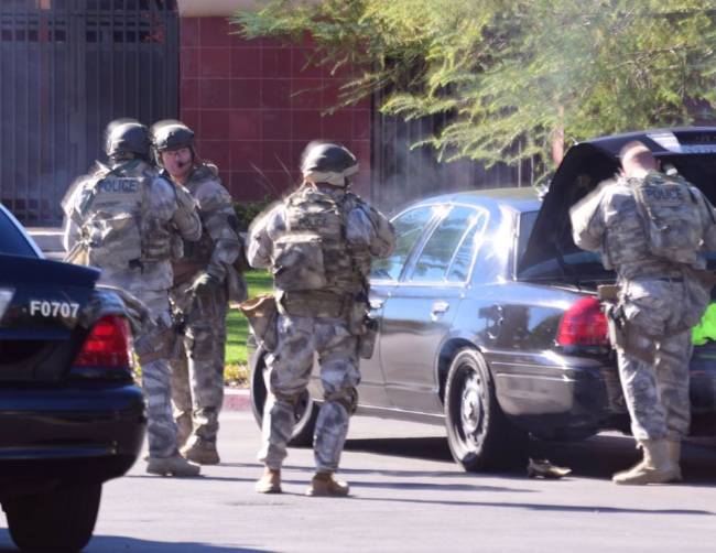 A SWAT team arrives at the scene of a shooting in San Bernardino Calif. on Wednesday Dec. 2 2015. Police responded to reports of an active shooter at a social services facility