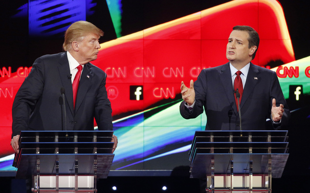 Donald Trump left watches as Ted Cruz speaks during the CNN Republican presidential debate at the Venetian Hotel & Casino on Tuesday Dec. 15 2015 in Las