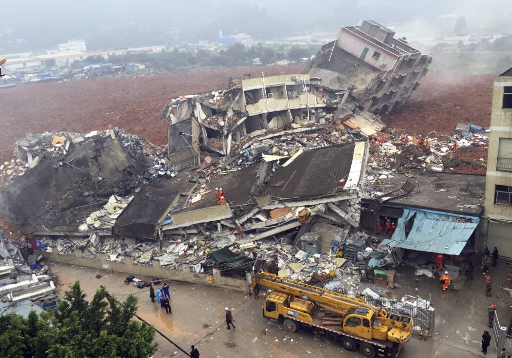 Huge landslide traps residents and buries buildings in Chinese city