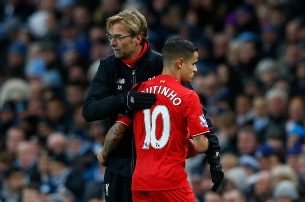 Philippe Coutinho is congratulated by manager Jurgen Klopp as he is substituted