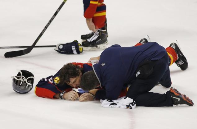 Panthers right wing Jaromir Jagr is on the ice after a stick to the face