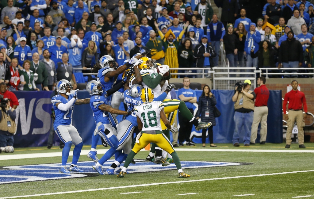 Green Bay Packers tight end Richard Rodgers falls into the end zone after catching a 61-yard pass for a touchdown on the last play of an NFL football game against the Detroit Lions Thursday Dec. 3 2015 in Detroit