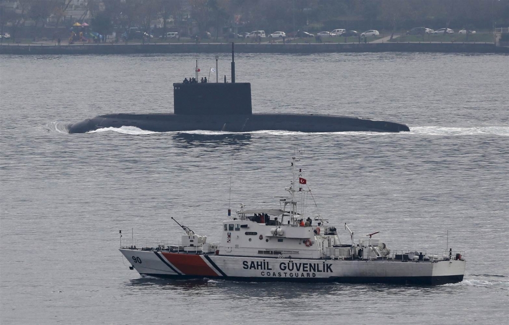 Image Russia's diesel-electric submarine Rostov-on Don is escorted by a Turkish Navy Coast Guard boat as it sets sail in the Bosphorus on its way to the Black Sea in Istanbul Turkey