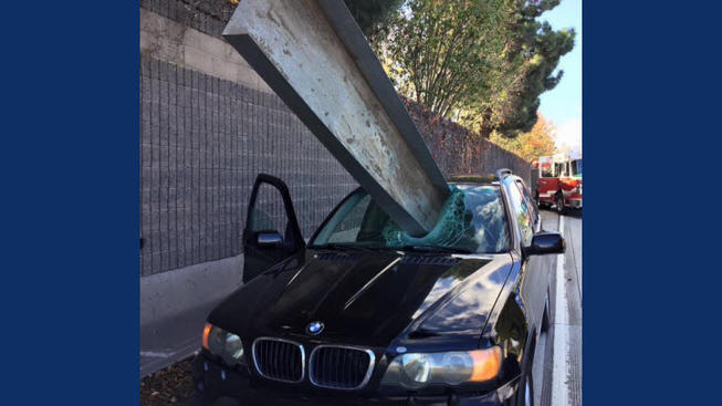 Metal tray crashes through windshield, driver survives