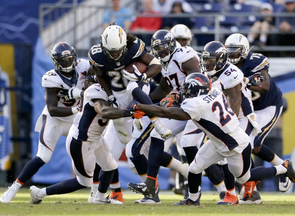 San Diego Chargers running back Melvin Gordon center rushes against the Denver Broncos on Sunday in San Diego. GREGORY BULL, ASSOCIATED PRESS