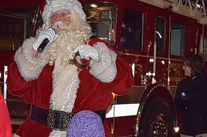 Santa Claus talks with those who gathered at the Christmas Parade Friday night.			Samantha McDaniel-Ogletree | Journal-Courier