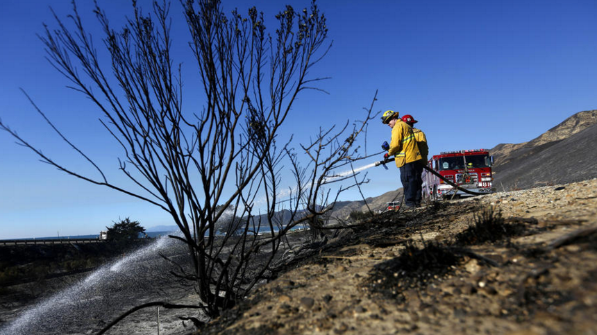 Santa Paula firefighters attack hot spots from the Solimar Fire along 101 Freeway