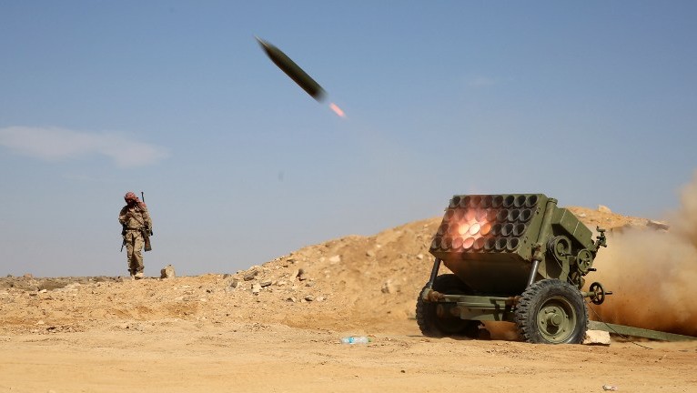 Armed Yemeni tribesmen from the Popular Resistance Committees supporting forces loyal to Yemen's Saudi-backed President Abedrabbo Mansour Hadi fire as they hold a position in the area of Sirwah west of Marib city