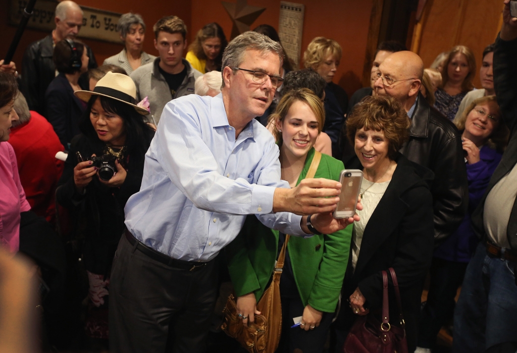 CEDAR RAPIDS IA- MARCH 07 Former Florida Governor Jeb Bush takes a selfie with Iowa residents after speaking at a Pizza Ranch restaurant