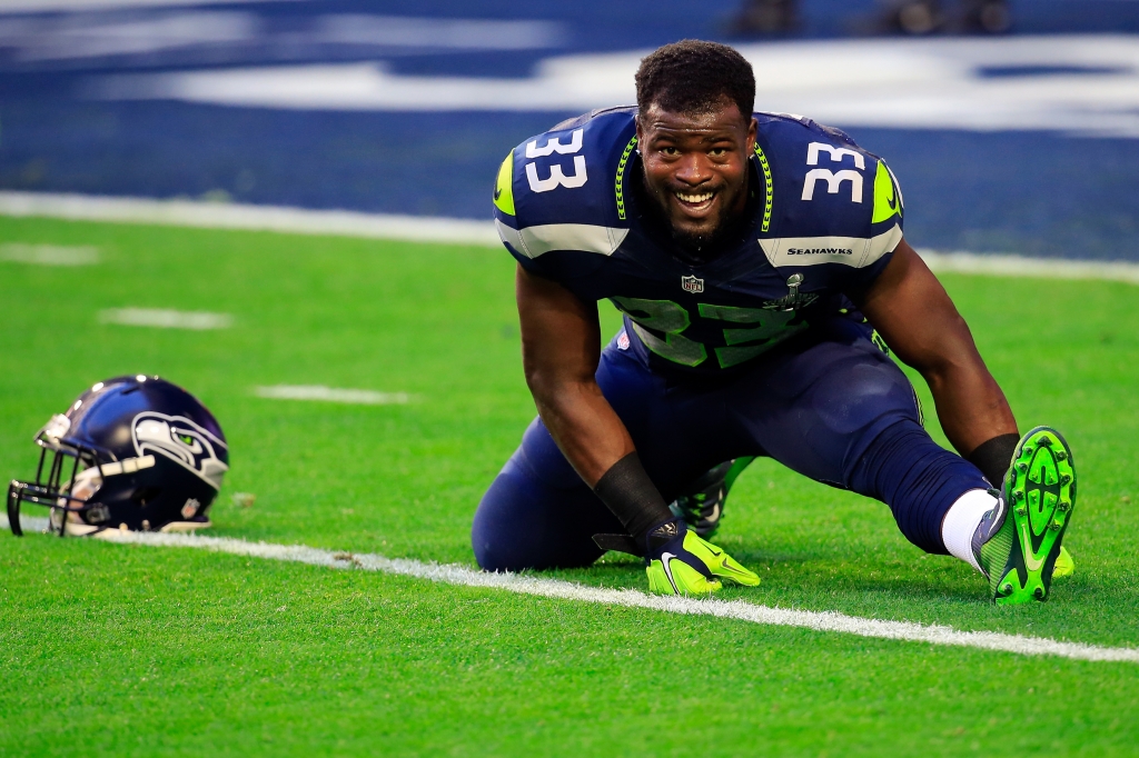 Christine Michael #33 of the Seattle Seahawks stretches prior to Super Bowl XLIX against the New England Patriots at University of Phoenix Stadium