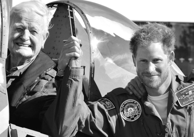 Prince Harry with Tom Neil and Matt Jones after the 95-year-old ex-wing commander and Battle of Britain Hurricane and Spitfire pilot took part in the Battle of Britain Flypast to mark the 75th anniversary of victory in the Battle of Britain at Goodwood Ae