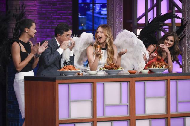 Victoria's Secret Models Adriana Lima Behati Prinsloo and Taylor Hill eat hot wings with Stephen Colbert on “The Late Show.”