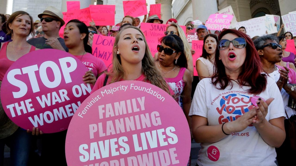 Planned Parenthood supporters rally for womens access to reproductive health care on National Pink Out Day at Los Angeles City Hall Tuesday Sept. 29 2015