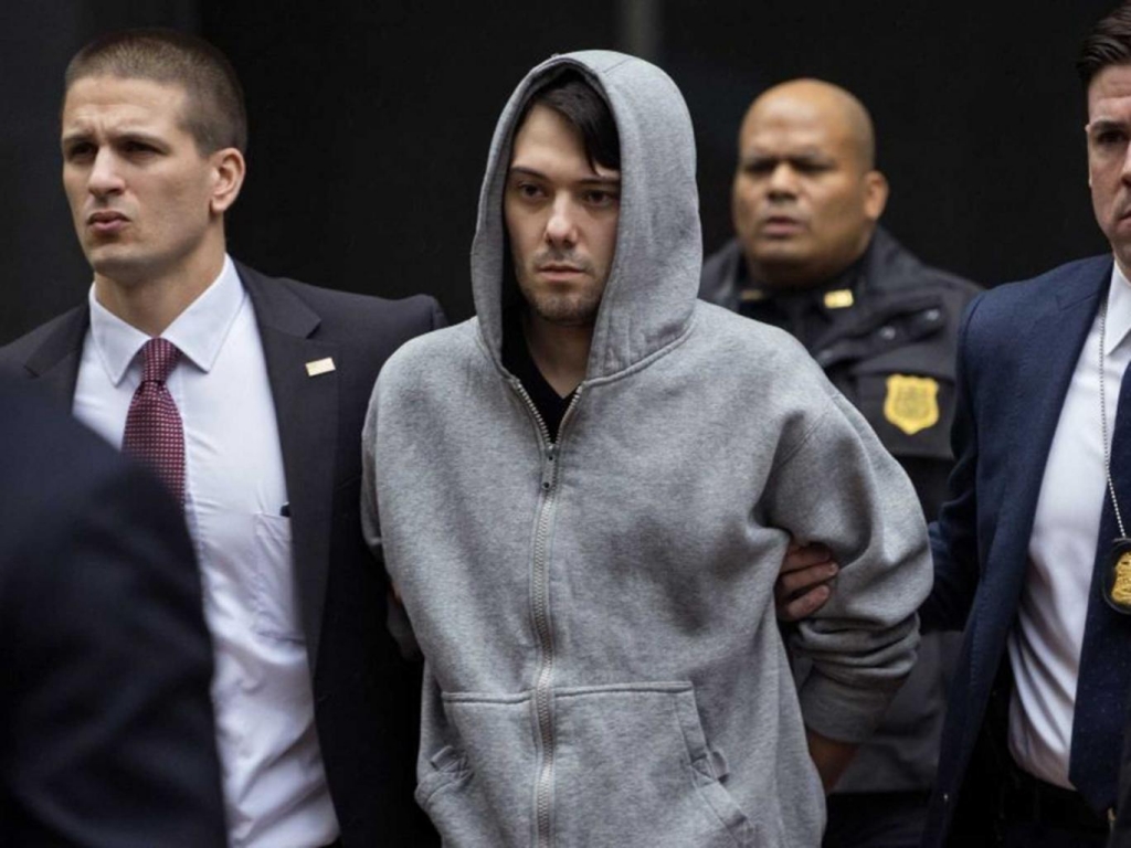 Shkreli is escorted from his building by FBI agents AP