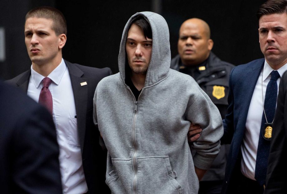 Martin Shkreli the former hedge fund manager under fire for buying a pharmaceutical company and ratcheting up the price of a life-saving drug is escorted by law enforcement agents in New York Thursday Dec. 17 2015 after being taken into custody follo