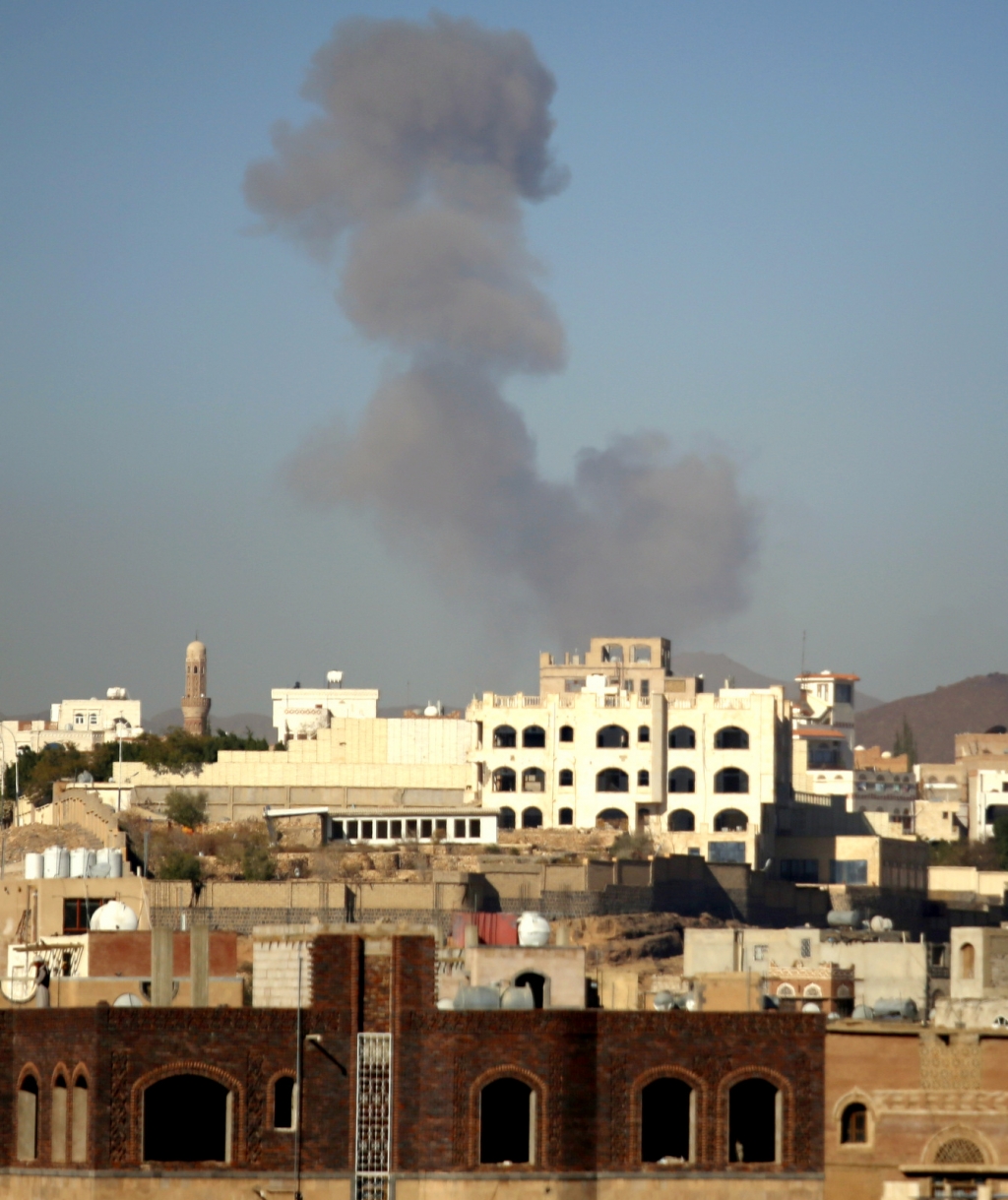 Smoke rises after a Saudi-led airstrike hits an army base in Sanaa Yemen Saturday Dec. 5 2015