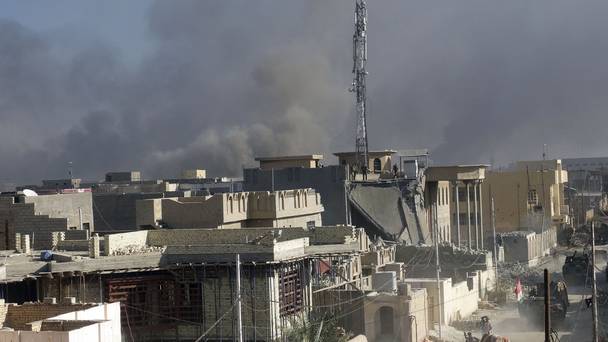 Smoke rises as Iraqi security forces attack the government complex in central Ramadi