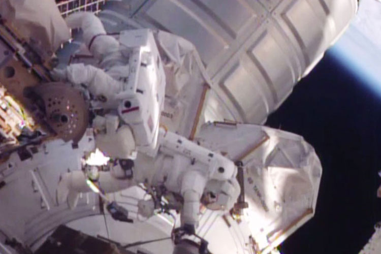 Spacewalkers Scott Kelly and Tim Kopra work to move stalled robotic transporter before moving on to'get-ahead tasks. Credit NASA TV