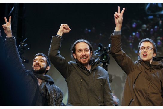 Podemos party leader Pablo Iglesias centre raises his arm next to fellow party members as he is cheered by supporters during Spain's general election in Madrid on Sunday. Prime Minister Mariano Rajoy's Popular Party won the election but fell short of