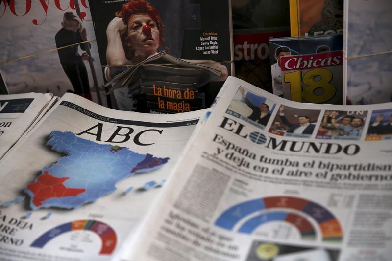 Newspapers can be seen at a kiosk a day after the most fragmented national election result in Spain's history in Madrid Spain