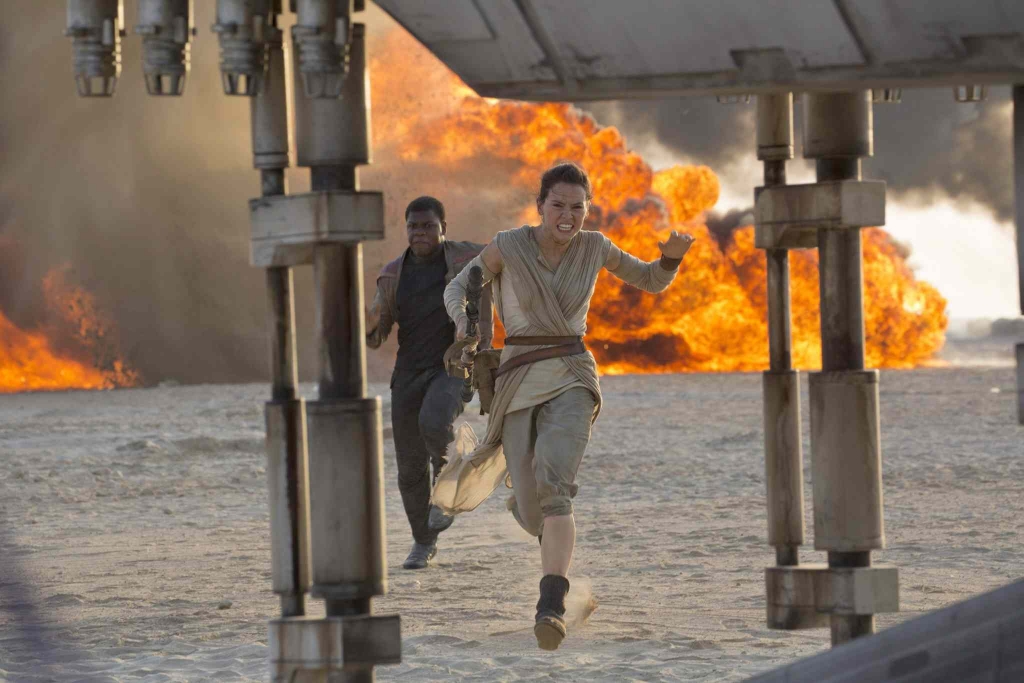 Lucasfilm shows Daisy Ridley right as Rey and John Boyega as Finn in a scene from the film