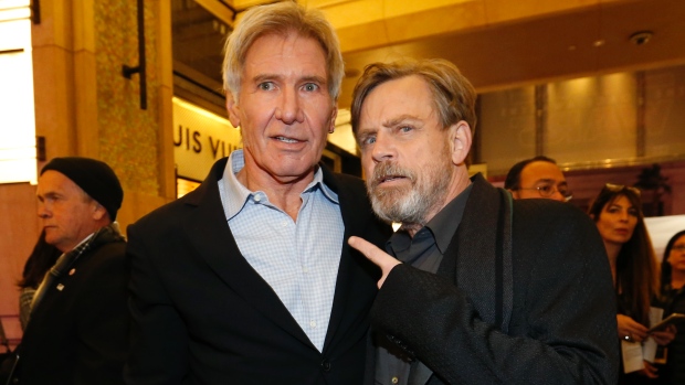 Actors Harrison Ford left and Mark Hamill arrive at the premiere of Star Wars The Force Awakens in Hollywood Calif. on Monday