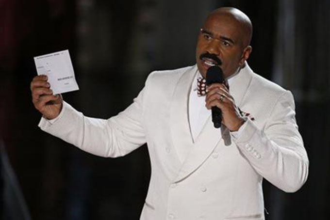 Steve Harvey holds up the card showing the winners after he incorrectly announced Miss Colombia Ariadna Gutierrez at the winner at the Miss Universe pageant Sunday Dec. 20 2015 in Las Vegas. According to the pageant a misreading led the announcer to