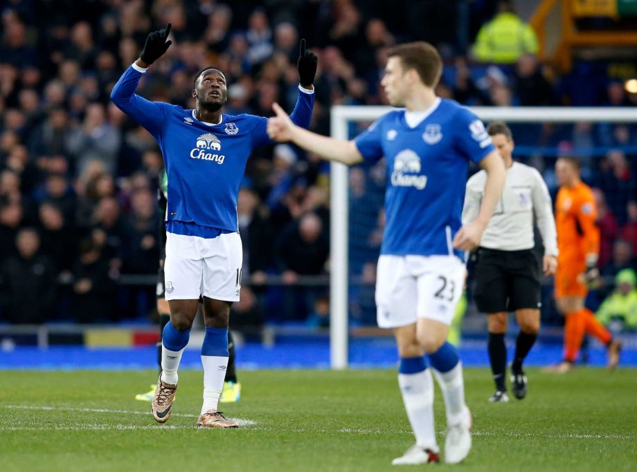 Everton's Romelu Lukaku, left celebrates scoring his team's first goal of the match during the English Premier League match between Everton and Stoke City at Goodison Park in Liverpool England Monday Dec. 28 2015.  UNITED