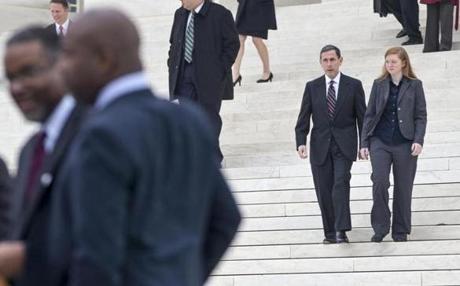 Abigail Fisher who challenged the use of race in college admissions right walked with lawyer Edward Blum at the Supreme Court Wednesday