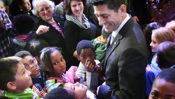 Fourth-grade children from Jerstad Agerholm Elementary School surround House Speaker Paul Ryan of Wisconsin in Racine Wisconsin