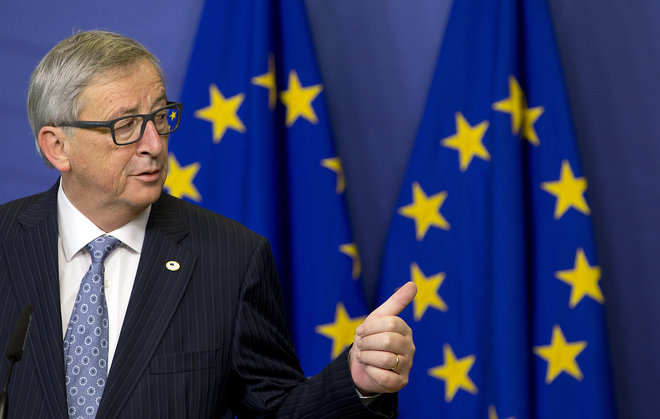 European Commission President Jean Claude Juncker gestures while speaking during a media conference at EU headquarters in Brussels on Thursday Dec. 17 2015. European Union heads of state meet Thursday to discuss among other issues the current migratio