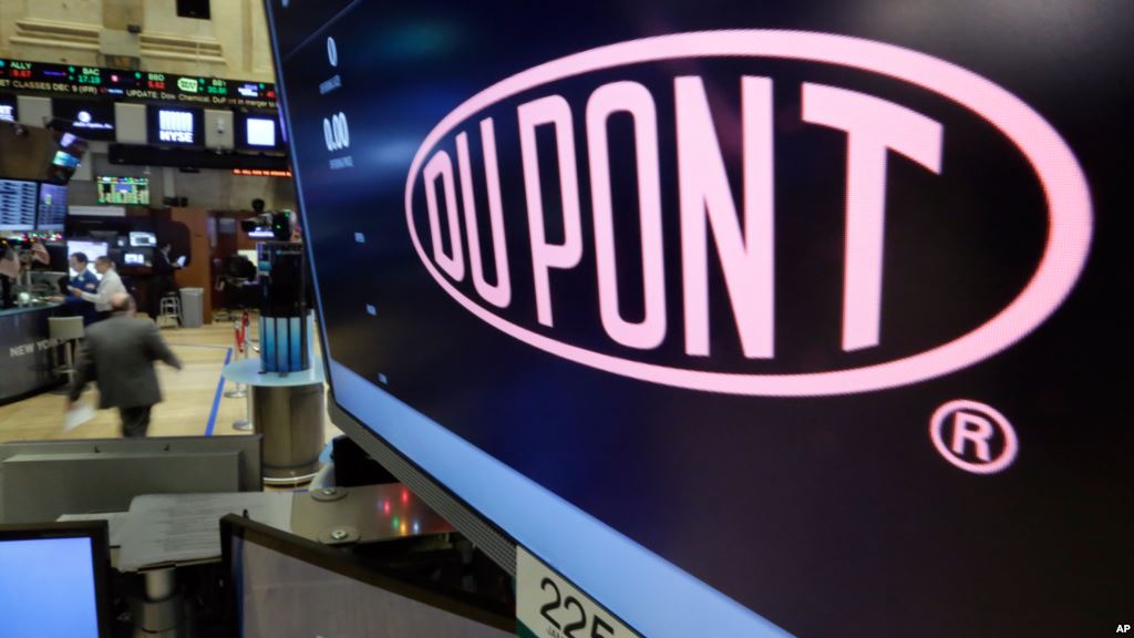 The company name of Dupont appears above its trading post on the floor of the New York Stock Exchange Dec. 9 2015