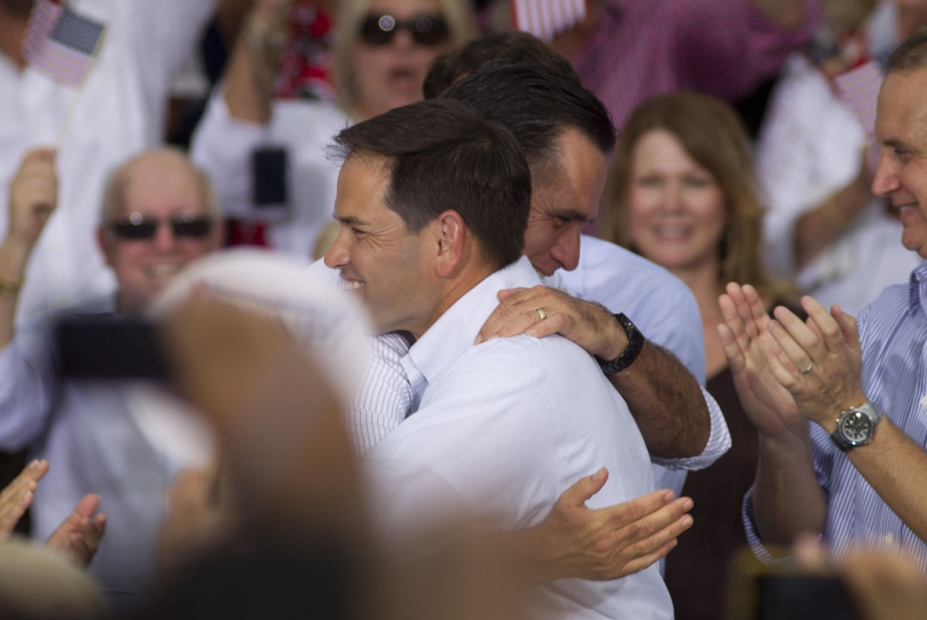 Marco Rubio hugs Mitt Romney during a campaign stop in Miami in 2012 when Romney was running for president. Might Romney endorse Rubio for president now