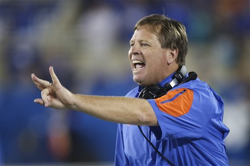 Florida head coach Jim Mc Elwain instructs his team during the second half of an NCAA college football game against Kentucky in Lexington Ky. Mc Elwain has genuine reverence for Alabama's Nick Saban. It's obviou
