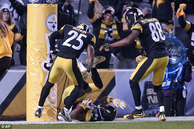 The 27-year-old crashes to the after completing his brilliant run for the posts at Heinz Field in the NFL