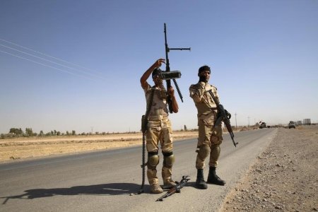 Fighters from the Shi'ite Badr Brigade militia set up a mobile checkpoint in Suleiman Beg northern Iraq