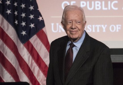 Former U.S. President Jimmy Carter arrives to speak during an event honoring former U.S. Vice President Walter Mondale hosted by the Humphrey School of Public Affairs at the University of Minnesota in Washingt