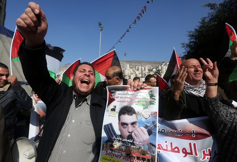 Palestinians chant slogans against Israel during a demonstration in support of late Lebanese terrorist Samir Kantar in the West Bank city of Nablus