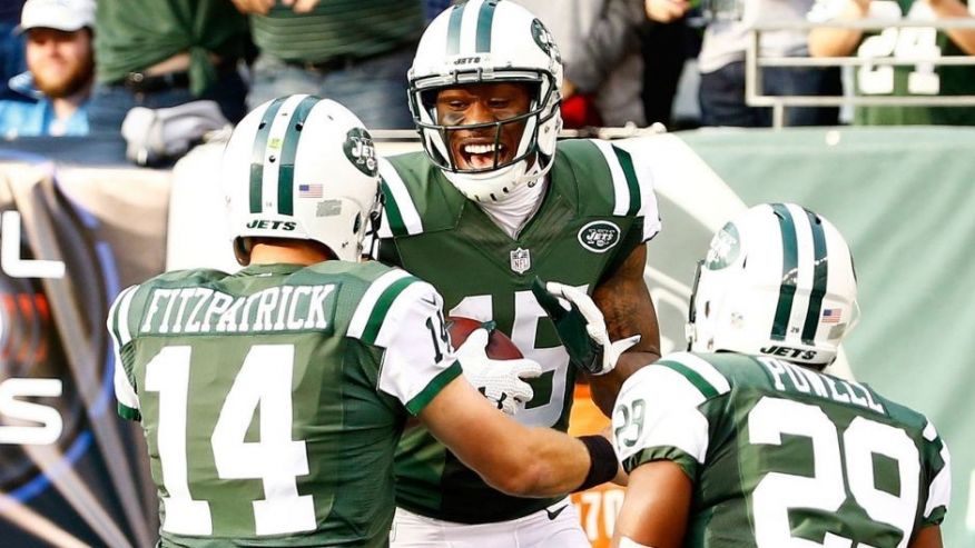 EAST RUTHERFORD NJ- DECEMBER 13 Brandon Marshall #15 of the New York Jets celebrates with Ryan Fitzpatrick #14 after scoring a touchdown in the second quarter against the Tennessee Titans during their game at Met Life Stadium