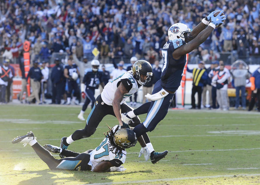 Tennessee Titans wide receiver Dorial Green Beckham gets past Jacksonville Jaguars defenders Johnathan Cyprien and Dwayne Gratz as Green Beckham scores a touchdown on a 47-yard pass play in the second half of an NFL football game Sunday De