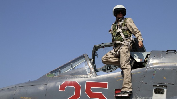 A Russian army pilot poses on the cockpit of SU-25M jet fighter. Russia has insisted its air strikes are targeting Islamic State and al-Qaeda's Syrian affiliates