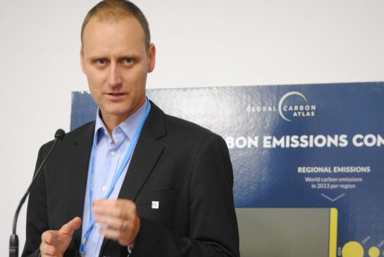 Researcher Glen Peters of the Center for International Climate and Environmental Research briefs reporters in Paris on Monday