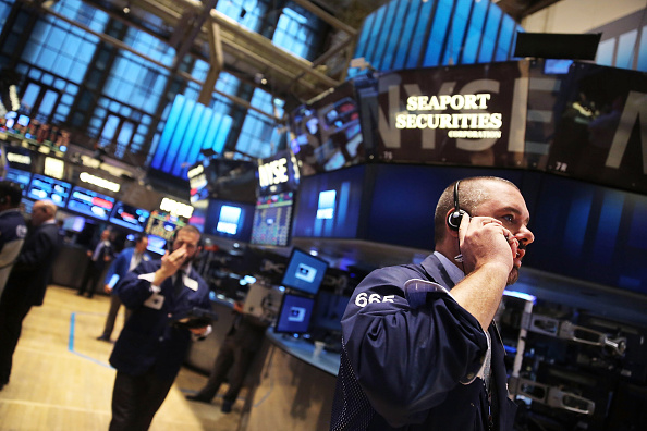 Traders work on the floor of the New York Stock Exchange