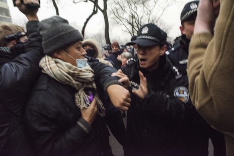 Chinese police push away journalists and supporters of human rights lawyer Pu Zhiqiang demonstrating near the Beijing Second Intermediate People's Court in Beijing on Dec. 14. One of China's most celebrated human rights lawyers went on trial Dec. 14 over