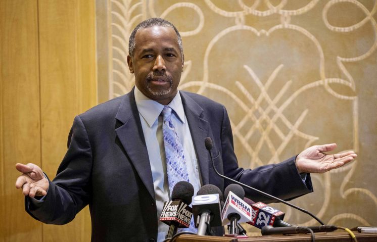 Republican presidential candidate Ben Carson takes questions from reporters Thursday at the Peninsula Hotel in Chicago after a roundtable meeting with pastors